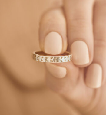 An image of a hand holding a beautiful ring
